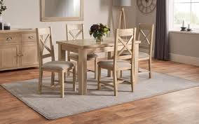 The table extends by sliding out the two. Romeo 1 25m Extending Dining Table 4 Cross Back Chairs