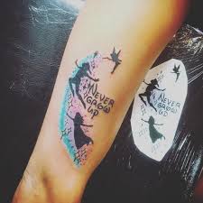 Colorful tinkerbell and peter pan tattoo on couple wrist. Tattoo Quotes Peter Pan Tattoo Design