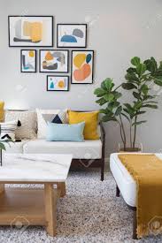 Because i seem to be obsessed with colour in home decor at the moment! Fashionable Living Room Interior With Yellow And Blue Accents Stock Photo Picture And Royalty Free Image Image 151544394