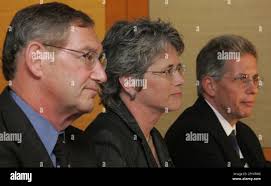 AIDS researchers Dr. Larry Corey, from left Margaret Johnston Ph.D., and  Dr. Keith Gottesdiener, speak at a Seattle news conference, October 7,  2007,