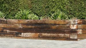 Landscape timber edging adds a tidy but natural look to garden beds, lawns, and other landscape features. Timber Concrete Sleepers Ecowood Sleepers All Green Melbourne