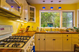 Mix dark wood and sandy yellow for a rustic effect. 30 Beautiful Yellow Kitchen Ideas