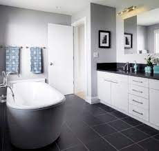 How To Use Dark Floors To Brighten Your Dull Home Black Bathroom Floor Dark Gray Bathroom Gray Tile Bathroom Floor