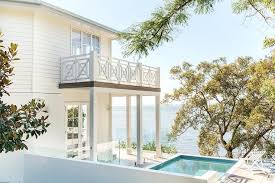 The brazilian black slate, on the sunroom floor, extends to the outdoor terrace; Second Floor Balcony Design Ideas