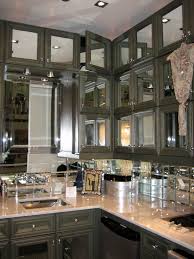 If you want something more unusual to spice up your bedroom décor, an apothecary design is great as a mirrored lingerie chest in your bedroom or for storing amenities in your bathroom. Elegant Minimalist Kitchen Design With Mirrored Door Kitchen Small Modern Kitchen With Mirrored Kitchen Cabinets Tierney Kitchens