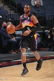 Chris paul is reportedly headed to phoenix to team up with devin booker. Chris Paul Of The Phoenix Suns Handles The Ball During The Game In 2021 Chris Paul Phoenix Suns Chris Paul Jersey