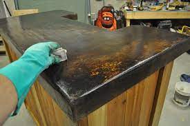 Waxed fiber tubes, readily available at home improvement centers and lumberyards, make forming and pouring footings and piers a relatively easy job. Patio Bar Plans Concrete Counter And Cedar Base