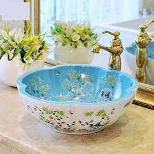 They include rustic, shabby chic, industrial, modern, and countryside farmhouse vessel sinks are equipped with cabinets that hold the sink that you can place above your bathroom counter top. European Style Flower Shaped Art Basin Washbasin Bathroom Sinks Ceramic Wash Basin Flower And Bird Pattern Wash Basin Shape Art Bathroom Sink