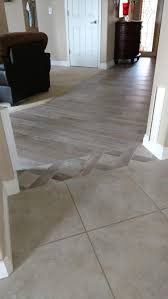 Tile Transition From Family Room To Kitchen Living Room Tiles Tile Floor Living Room Transition Flooring