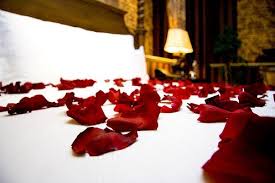 Lit Candles Rose Petals On The Bed Can Add Romance In Your Bedroom Rose Petals Valentines Rose Petal Candle