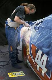 117 races in car #7; Kyle Petty Doing Work On His Car Nascar