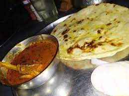 Loads Of Butter On Roti With Chicken Handi Is Next To Heaven Chicken Handi Food Cheese Pizza