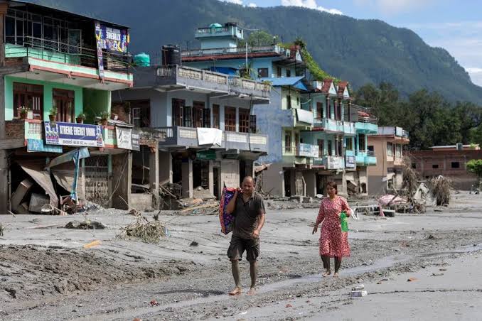 Nepal flood survivors return to ruins to salvage memories | The Straits  Times