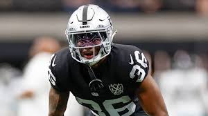 Pete Carroll and Kyu Blu Kelly