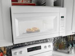 Amana Four Micro Ondes Avec Hotte Integree 1 6 Pi Blanc Yamv2307pfw Leon