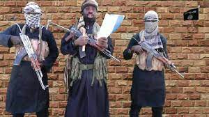 Boko haram leader abubakar shekau holds a weapon in an unknown location in nigeria in this still image taken from an undated video obtained on january 15, 2018. 8hau Zibxvayqm