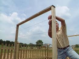 The bamboo poles have shifted out of line a bit, they aren't perfectly straight anymore and some of them have small splits or cracks at the bottom. How To Build A Trellis For Growing Peas How Tos Diy