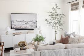 Here, 15 of our best decorating tips for making a living room the most popular hangout space in the house. Simple Tv Wall Decor Living Room Update Caitlin Marie Design