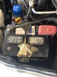 Place a piece of cardboard under the leaking area of the vehicle. Battery Leaking Acid When Brought In For Oil Top Off Justrolledintotheshop