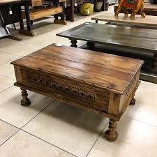 Is all in this video. Artisan Furniture Finds Carved Wood Coffee Table