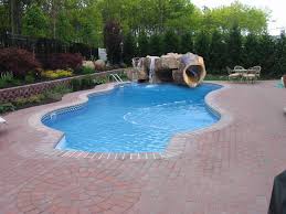 Everyone is falling in love with stand up paddle boarding for a good reason. Poolside Water Features Rock Water Slides Waterfalls Grottos Oasis Outdoor Living