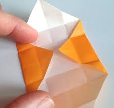 Then, remove the top layer of tape on those tabs, and tuck them in bringing the corners of the paper together to form the box. Diy How To Make Mini Paper Boxes