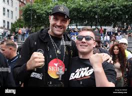 Tyson Fury (left) greets former boxer Nick Blackwell during the weigh-in at  The Great Northern, Manchester Stock Photo