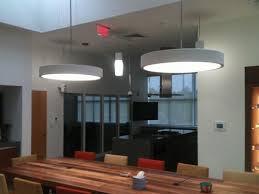 Suspended Concentric Pendants By Atlantic Lighting Over A Conference Table Conference Table Home Decor Table