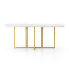 Unique oval shaping brings implied movement to the table. Devan Oval Dining Table In White Marble Burke Decor