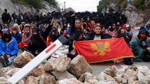Police in montenegro have fired teargas at protesters as the new head of the serbian orthodox church in the country arrived by helicopter . Wpvuvggxsd40zm