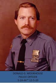 NYPD Patrolman teaching spanish to the Troops. Credit Criostoir Suilleabhain