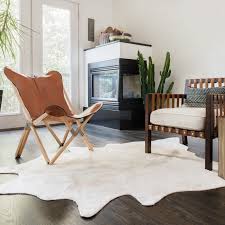This rug was the perfect alternative for a real cow hide rug.they are close to the real cow hide. Alexander Home Faux Cowhide Area Rug Overstock 9775358