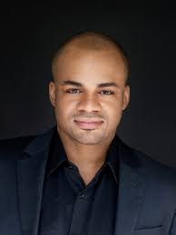 Fired music director claims racial bias