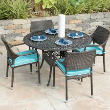 Gentilly 5 Piece Wicker Patio Dining Set W 48 Inch Round Table Sunbrella Canvas Aruba Cushions By Lakeview Outdoor Designs Bbqguys Outdoor Design Wicker Dining Set Patio Dining Set