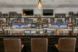 These backlit floating glass shelves were the perfect host for the resting place of the necessary household liquors. Custom Commercial Bar Countertops Creative Surfaces Inc