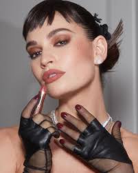 Just thinkin' about Lily James in custom Tamra Ralph Couture & De Beers at  the 2023 Met Gala celebrating Karl. She wore a corseted, spiky leather ball  gown, sheer gloves, debuted micro-fringe