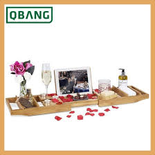 While unwinding in a relaxing bubble bath, the last thing you want to worry about is dropping your book, or cell phone, which is where this bamboo bathtub caddy comes in handy. Bathtub Caddy Tray Bamboo Adjustable Bath Tray With 2 Towel Boxes And Extending Sides Reading Rack Tablet Holder Cell Phone Tray China Bathtub Rack Bathroom Organizer Made In China Com