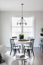 Pairing Black Windsor Chairs With A Round White Pedestal Dining Table Binds An A White Round Dining Table Round Pedestal Dining Table White Round Kitchen Table
