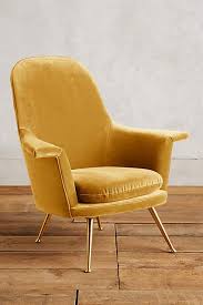 Supported by sturdy metal legs finished in brass. Gold Velvet Kimball Chair