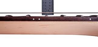 Action is a term used to describe the way an instrument is adjusted and how well it plays. How To Adjust And Lower The Action On An Electric Guitar Guitar Repair Bench