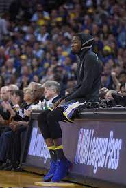 kevin durant of the golden state warriors looks on while sitting on the scorers table against the san antoni kevin durant nba basketball game ideas for baskets