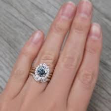 Emerson Blue Grey Iconic Moissanite Center Stone With A Canadian Diamond Halo 1 58ct Vintage Engagement Rings Unique Engagement Rings Diamond Wedding Bands