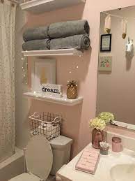 Chic pink and gray bathroom features pink wallpaper, a gray door, a gray shaker washstand with a white quartz vanity top and nickel and glass pulls, lit by a worlds away delilah silver wall sconce. Pin On Bathroom Things