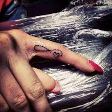 The infinity symbol itself holds meaning for love, beauty, spirituality, and power. 31 Cool Inner Finger Tattoos To Inspire You Ring Finger Tattoos Infinity Tattoos Inner Finger Tattoo