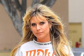 Heidi klum made a name for herself around the world as a victoria's secret model, project runway host, and america's got talent judge. Heidi Klum Channels The 80s In An Ultra Cropped Sweatshirt Slick Leather Pants The Sleekest Heels