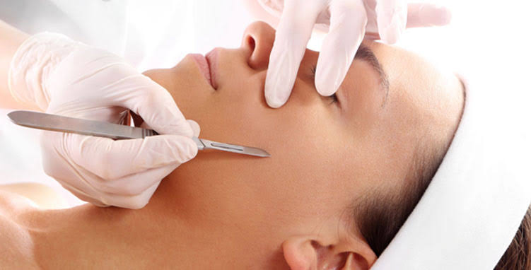 Beautician performing a facial treatment