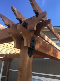 Decorative Metal Brackets Can Take Your Pergola From Plain To Stylish The Pergola Is The Crowning Feature Of M Metal Pergola Pergola Attached To House Pergola