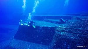 At a depth of 25 meters off the coast of the western japanese island of yonaguni are mysterious underwater pyramids and the remains of an ancient city, nowadays known as the submerged yonaguni monument. Yonaguni Monument Dive Site Yonaguni Japan