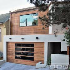 San Francisco Bay Area Custom Garage Door In A Modern Design With Glass Panels Modern Garage And Shed Modern Garage Doors Garage Door Design Modern Garage
