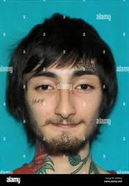 This photo provided by the Chicago Police Department shows Kameron Abram.  Abram is one of two men charged in a shooting that left two people dead and  seven injured outside a fast